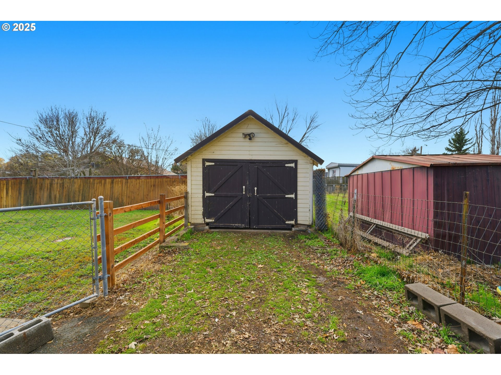 170 Morrison Street Adams, OR 97810 - Photo 24 of 33 a view of a backyard with grass and a barn