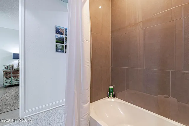 a living room with fireplace and flat screen tv