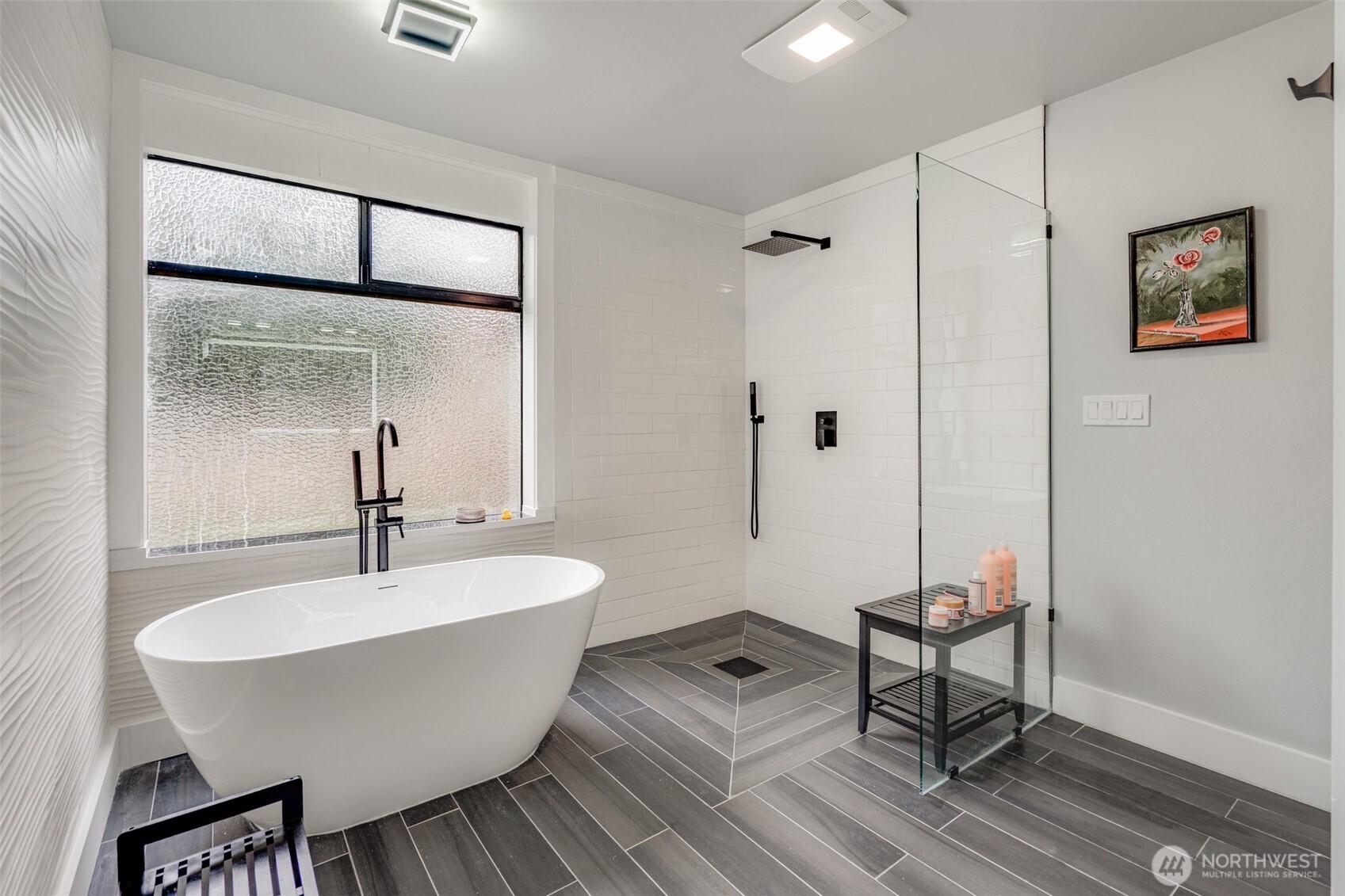 5341 South Bercot Road Freeland, WA 98249 - Photo 16 of 37 a bathroom with a bathtub and a sink