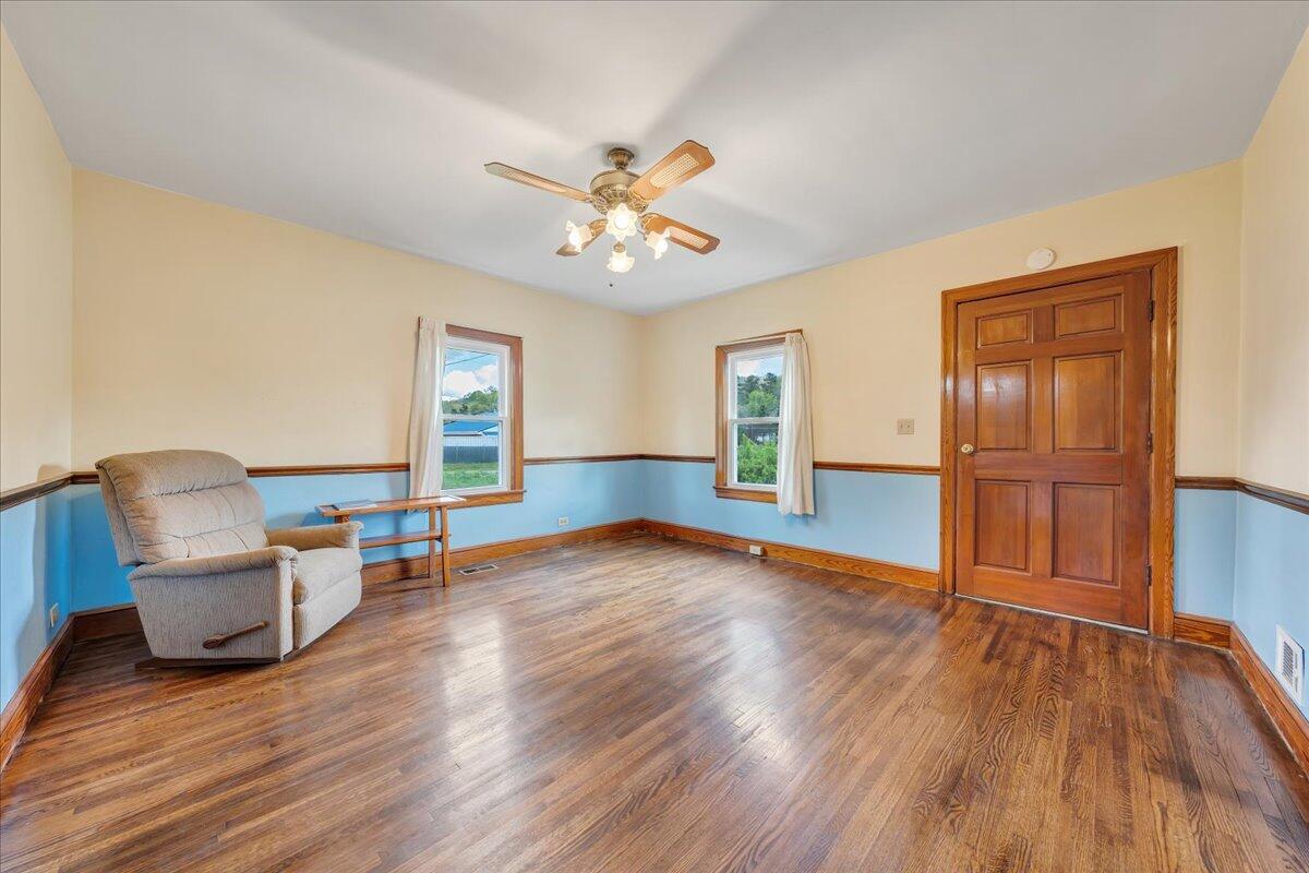 5265 Blue Ridge Boulevard Blue Ridge, VA 24064 - Photo 12 of 40 a view of an empty room with window and wooden floor