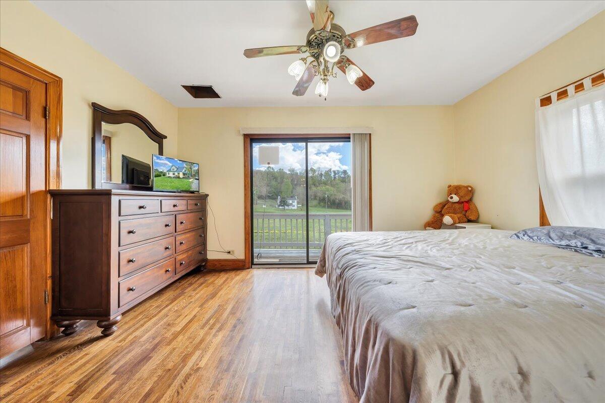 5265 Blue Ridge Boulevard Blue Ridge, VA 24064 - Photo 16 of 40 a bed room with a bed and a dresser