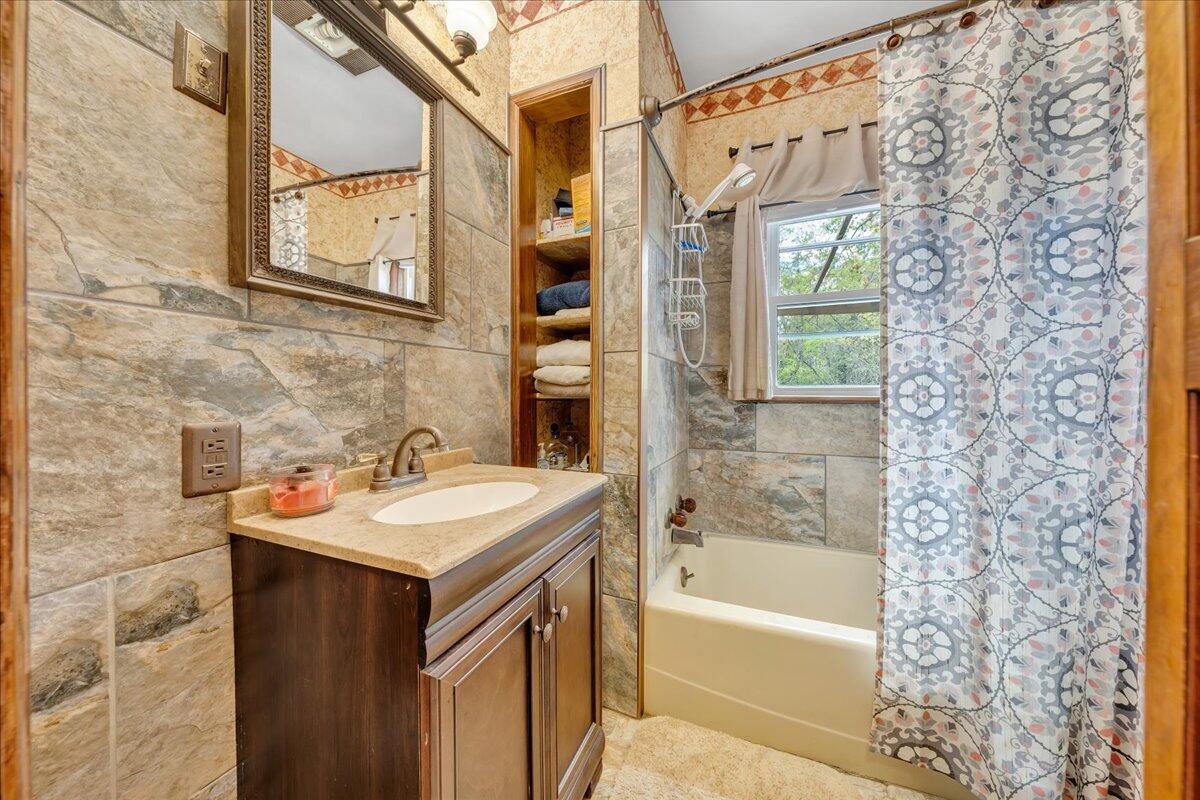 5265 Blue Ridge Boulevard Blue Ridge, VA 24064 - Photo 17 of 40 a bathroom with a sink and a bathtub