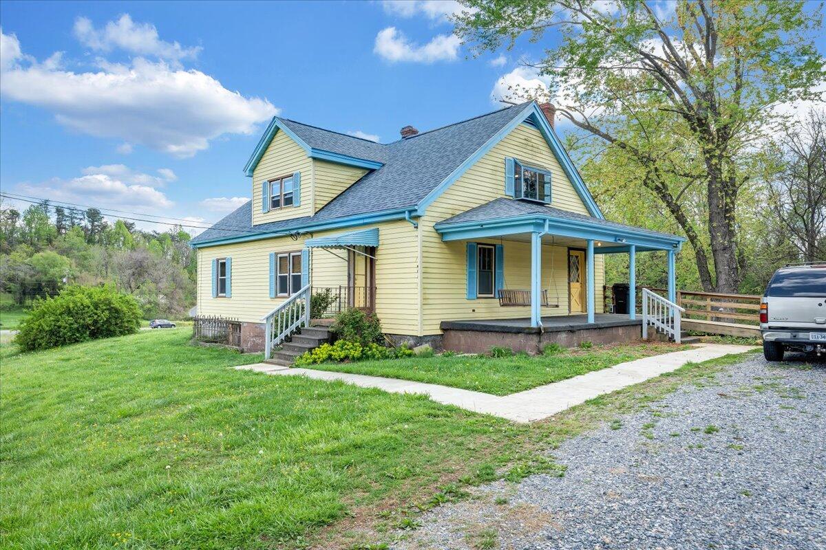 5265 Blue Ridge Boulevard Blue Ridge, VA 24064 - Photo 2 of 40 a front view of a house with a yard porch and outdoor seating