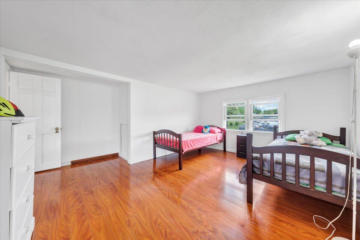 5265 Blue Ridge Boulevard Blue Ridge, VA 24064 - Photo 23 of 40 a bedroom with furniture and a wooden floor
