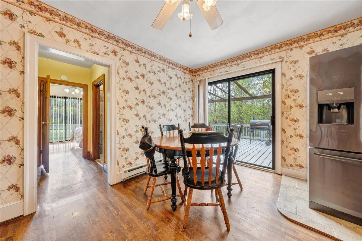 5265 Blue Ridge Boulevard Blue Ridge, VA 24064 - Photo 7 of 40 a dining room with furniture a chandelier and wooden floor