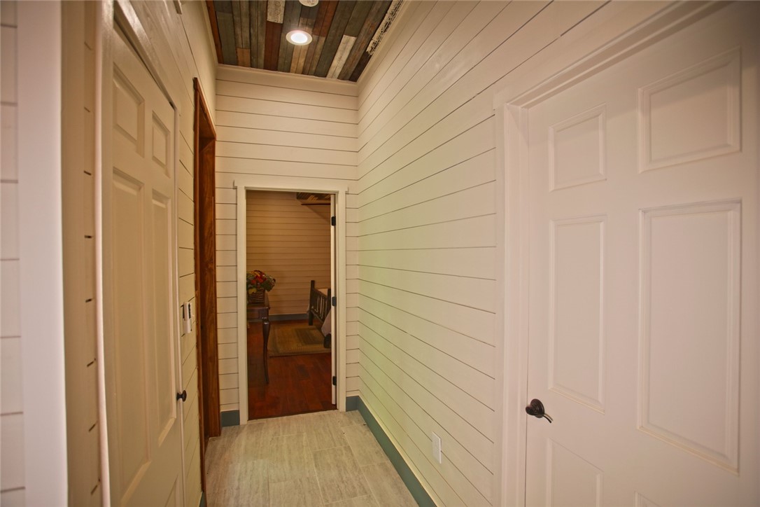 275 Jocassee Lake Road Salem, SC 29676 - Photo 19 of 41 This cozy hallway features unique wood paneling on the ceiling and bright recessed lighting.