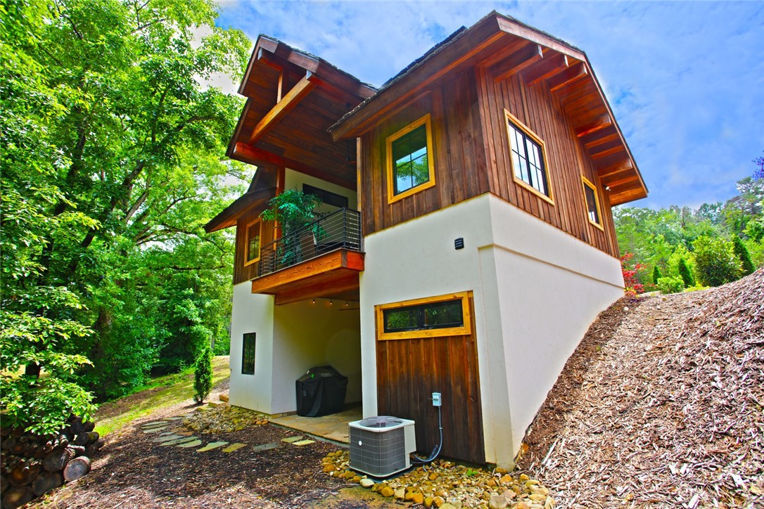 275 Jocassee Lake Road Salem, SC 29676 - Photo 2 of 41 This hillside retreat blends wood and stucco with an inviting outdoor balcony.