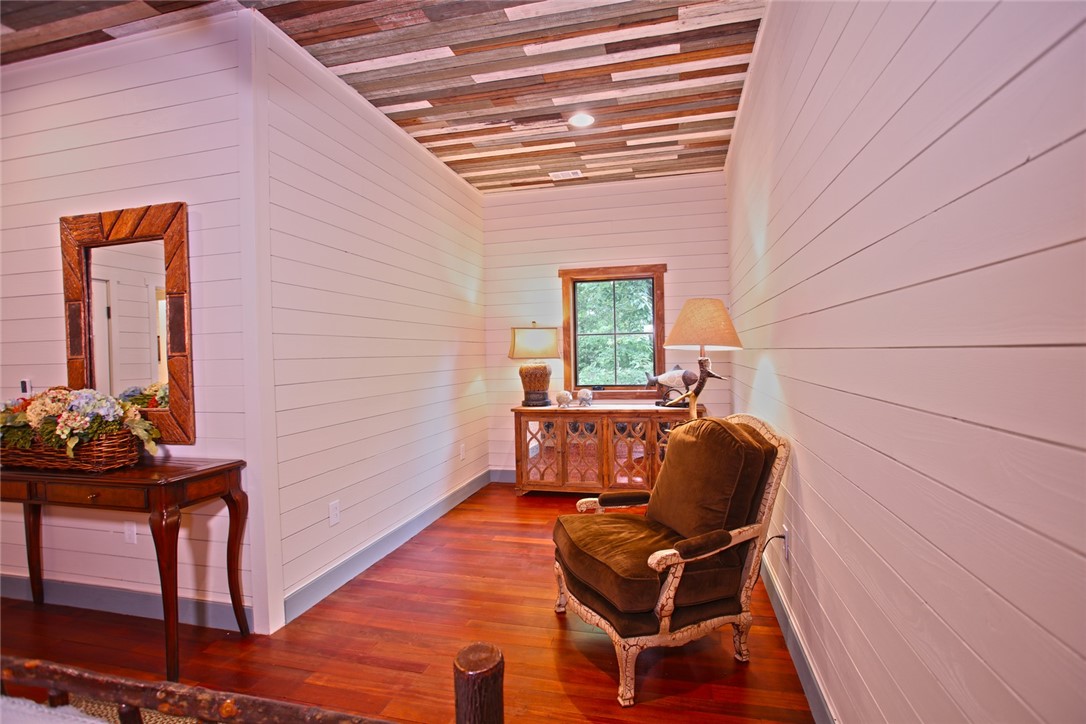 275 Jocassee Lake Road Salem, SC 29676 - Photo 27 of 41 This inviting nook features warm wood flooring and shiplap walls, creating a cozy and rustic ambiance.