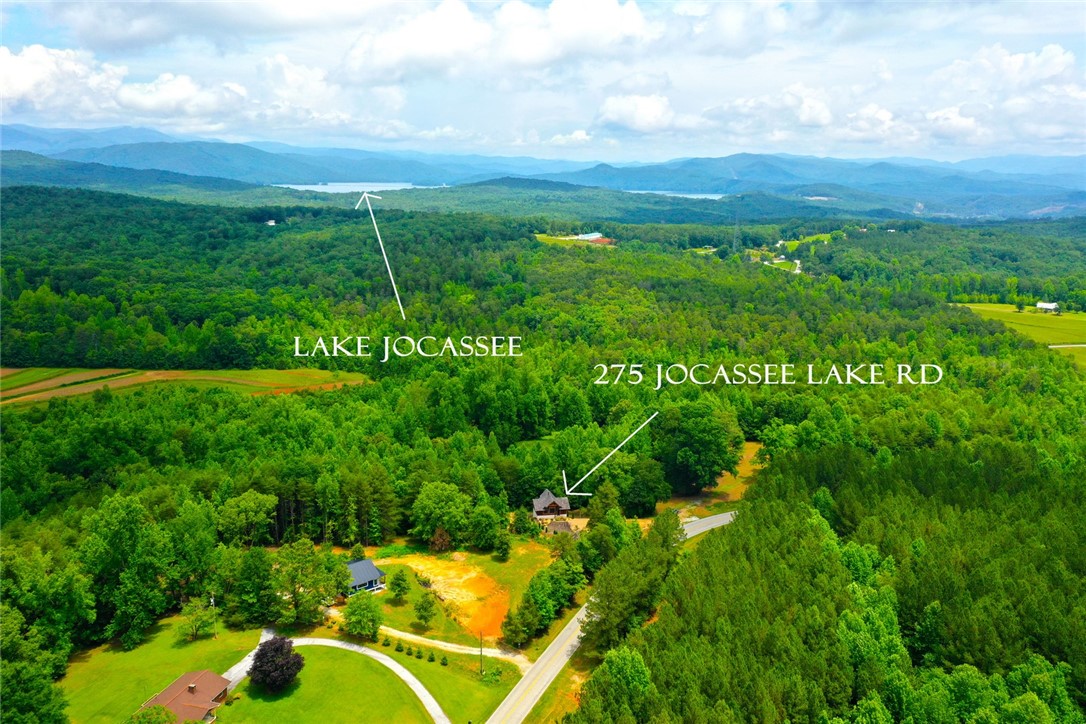 275 Jocassee Lake Road Salem, SC 29676 - Photo 29 of 41 This elevated view captures the extensive grounds, revealing distant waters and a secluded home.