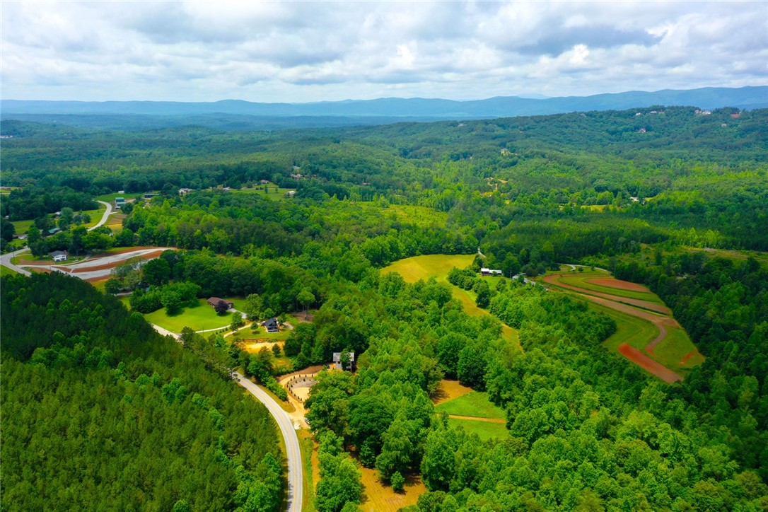 275 Jocassee Lake Road Salem, SC 29676 - Photo 38 of 41 Rolling hills and lush forests stretch under a wide sky, defining this expansive natural landscape.