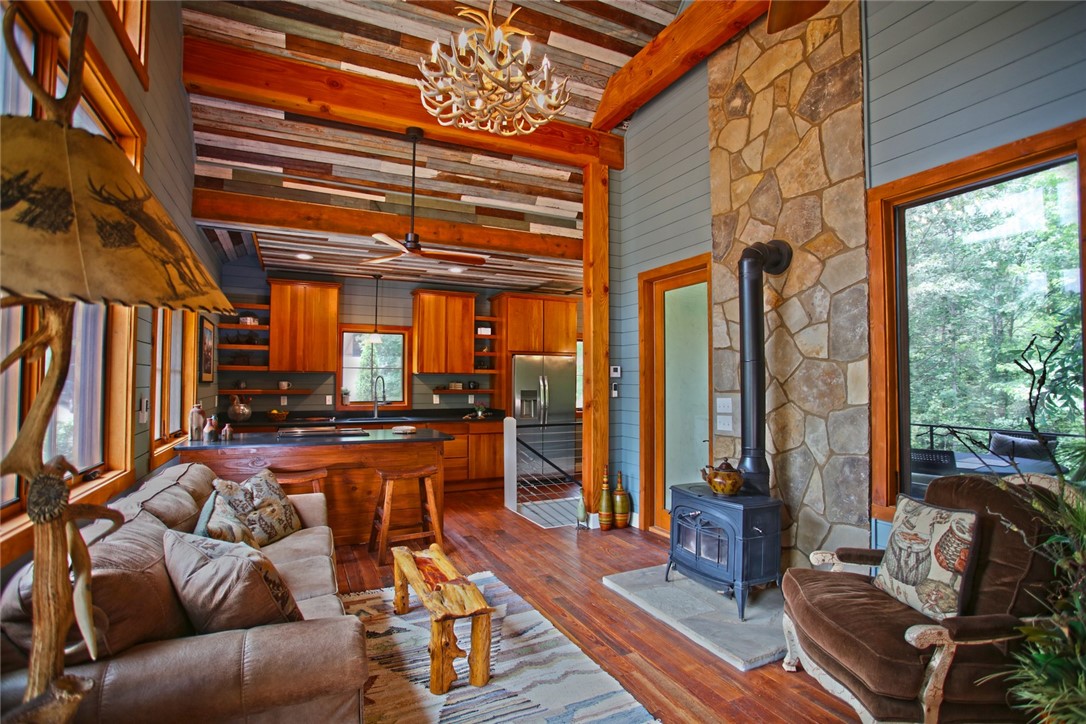275 Jocassee Lake Road Salem, SC 29676 - Photo 5 of 41 This living space seamlessly connects to the kitchen, showcasing rustic charm and natural wood accents.
