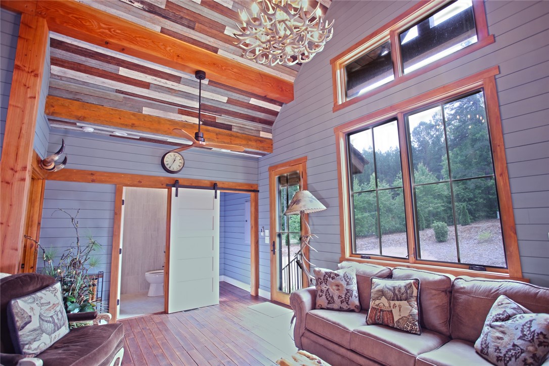 275 Jocassee Lake Road Salem, SC 29676 - Photo 7 of 41 This inviting space features vaulted ceilings and ample natural light, perfect for serene living.