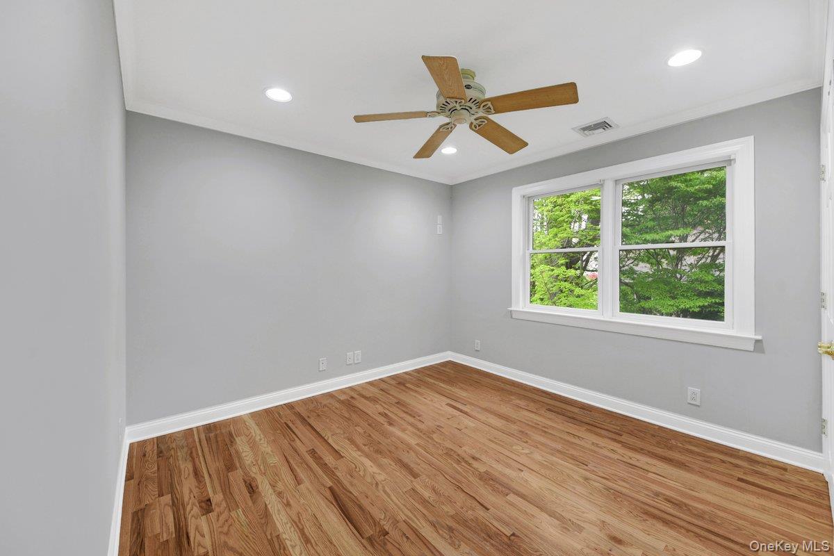 7 Rutledge Road Valhalla, NY 10595 - Photo 14 of 37 Spacious room featuring wood-finish flooring, a ceiling fan, recessed lighting, and a double-pane window with white trim