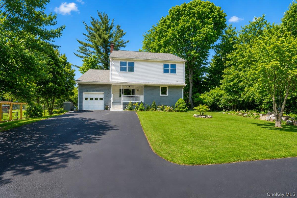 7 Rutledge Road Valhalla, NY 10595 - Photo 2 of 37 Two-story residence featuring a white and gray exterior with a front entry porch and an attached garage