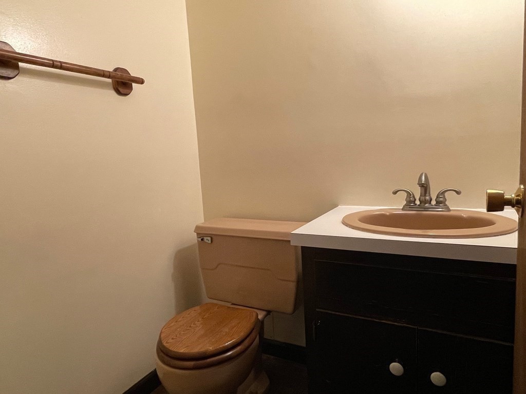 95 Hill Road Groton, MA 01450 - Photo 16 of 34 a bathroom with a sink a toilet and a mirror