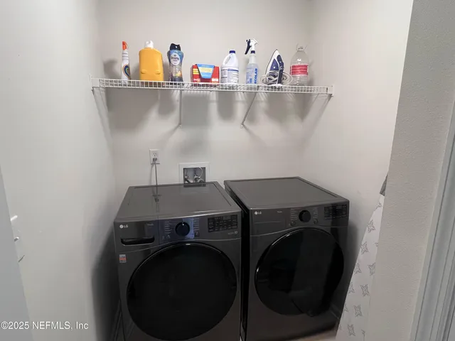 a utility room with dryer and washer