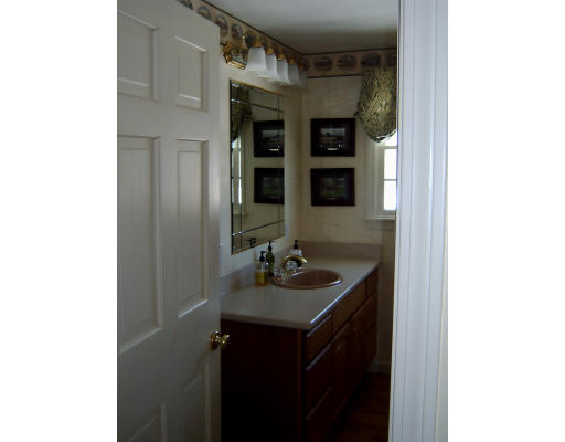 4 Plains Road Ipswich, MA 01938 - Photo 8 of 17 a bathroom with a sink and a mirror