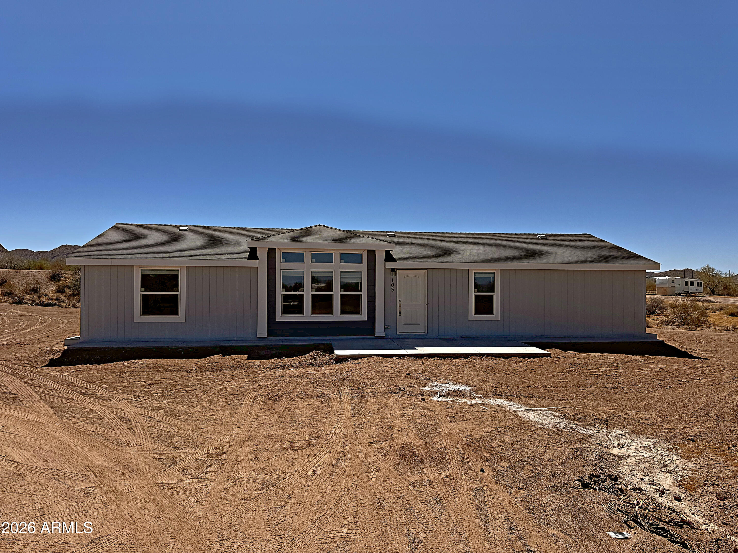 103 North Warren Road Maricopa, AZ 85139 - Photo 1 of 30 House2_Gray103_3988_enhanced