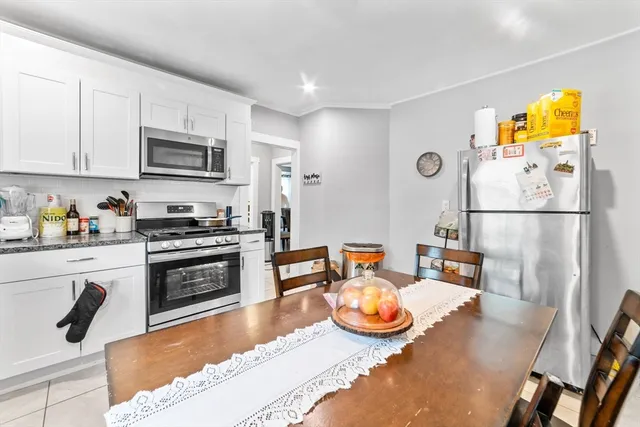 a kitchen with stainless steel appliances granite countertop a sink and refrigerator