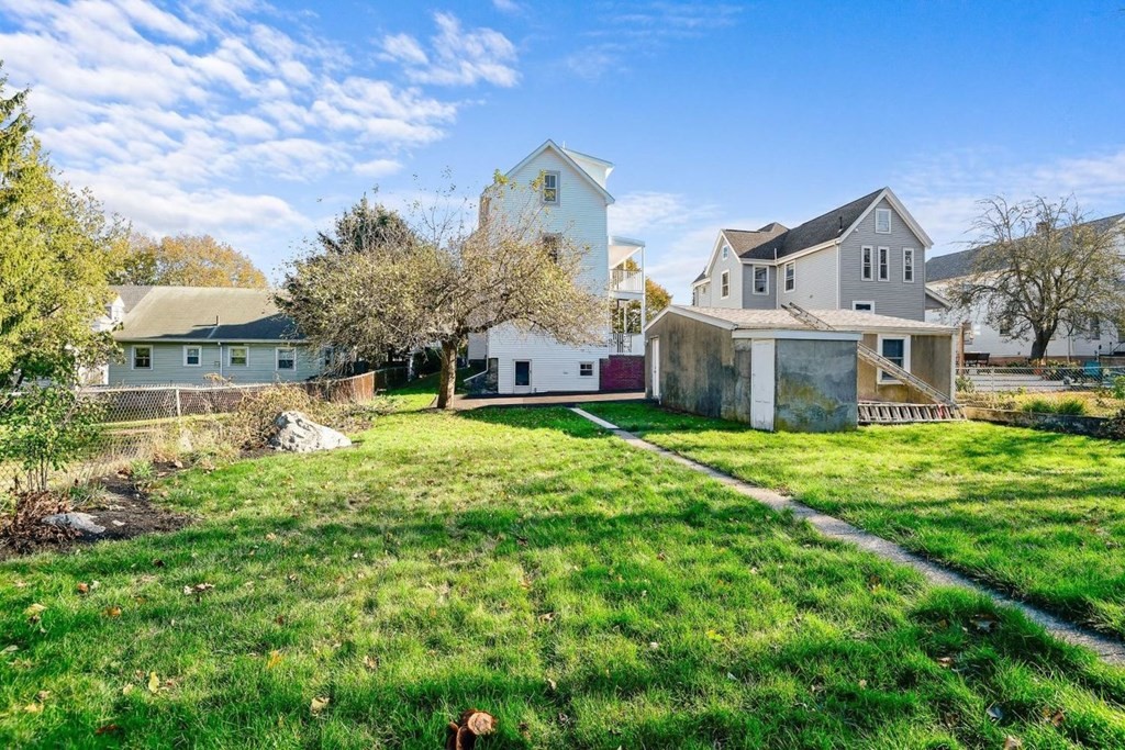 151 Beaver Street, Unit 2 Boston, MA 02136 - Photo 17 of 20 a front view of house with yard and green space