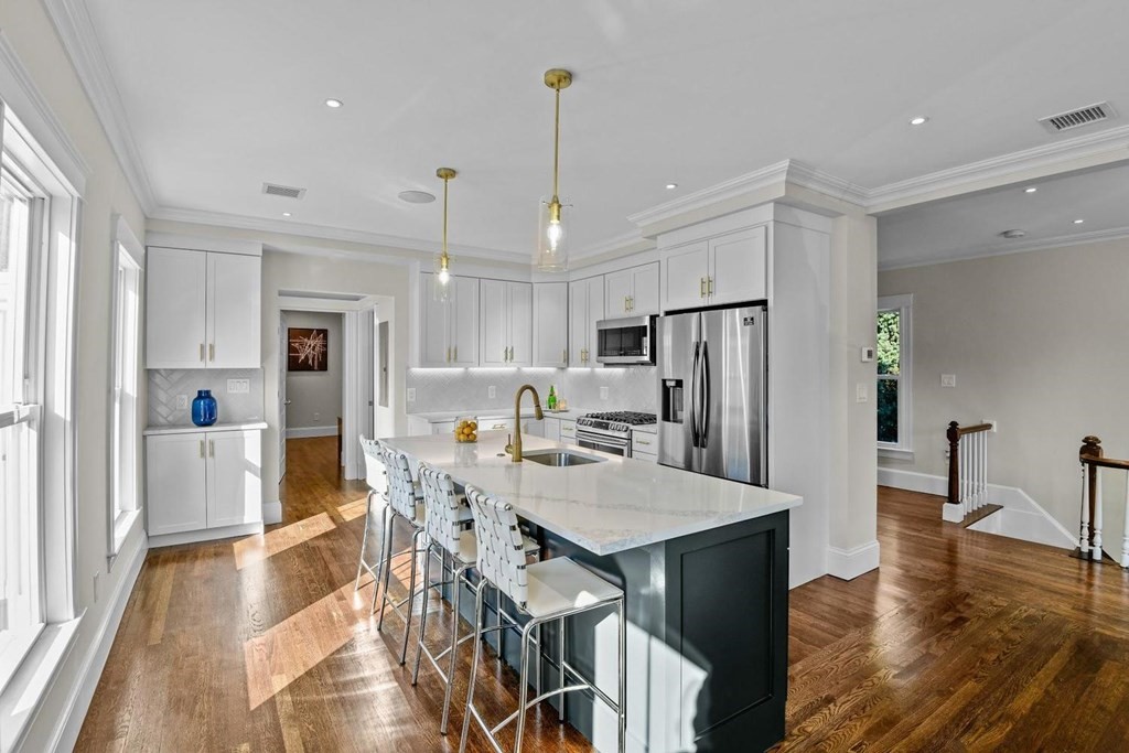 151 Beaver Street, Unit 2 Boston, MA 02136 - Photo 5 of 20 a view of a dining room and livingroom with furniture wooden floor a chandelier