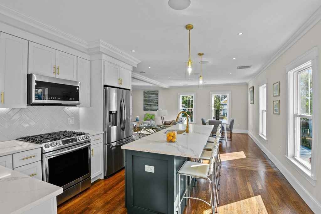 151 Beaver Street, Unit 2 Boston, MA 02136 - Photo 7 of 20 a view of a kitchen with dining table and chairs