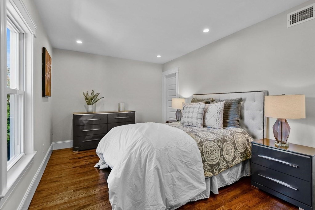 151 Beaver Street, Unit 2 Boston, MA 02136 - Photo 9 of 20 a bedroom with a bed and wooden floor