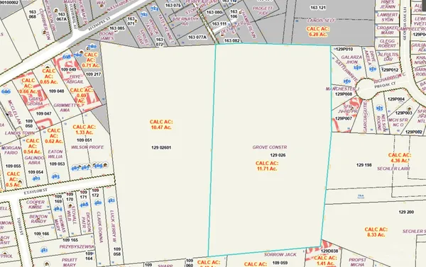 an aerial view of a houses with yard