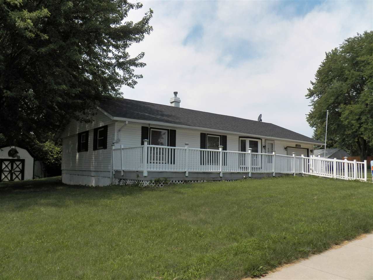2325 Forest View Road Rockford, IL 61108 - Photo 1 of 17 a house that has a big yard with wooden fence
