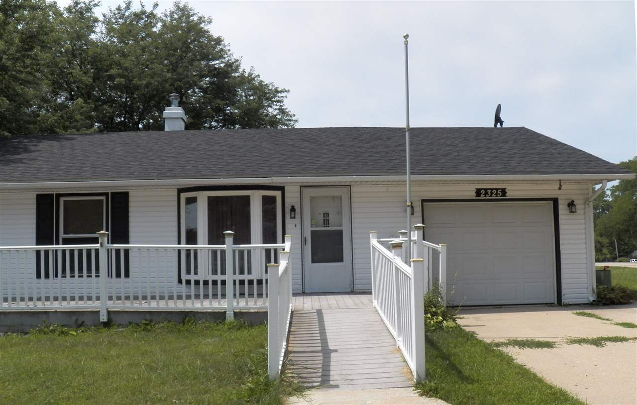 2325 Forest View Road Rockford, IL 61108 - Photo 2 of 17 a front view of a house with a yard