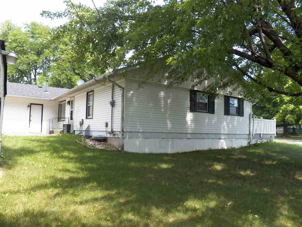 2325 Forest View Road Rockford, IL 61108 - Photo 3 of 17 a front view of a house with a garden