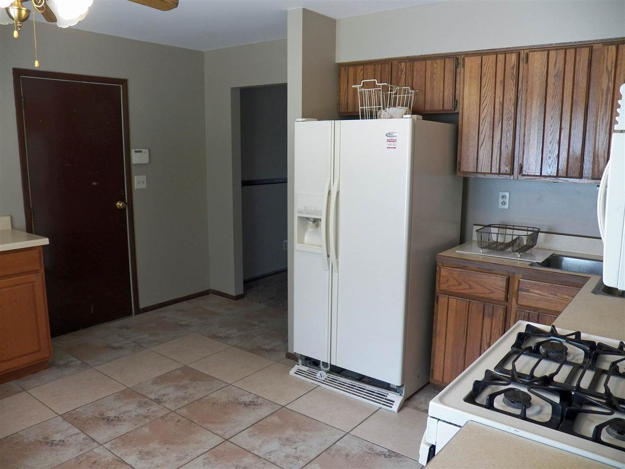 2325 Forest View Road Rockford, IL 61108 - Photo 5 of 17 a kitchen with a refrigerator and a stove