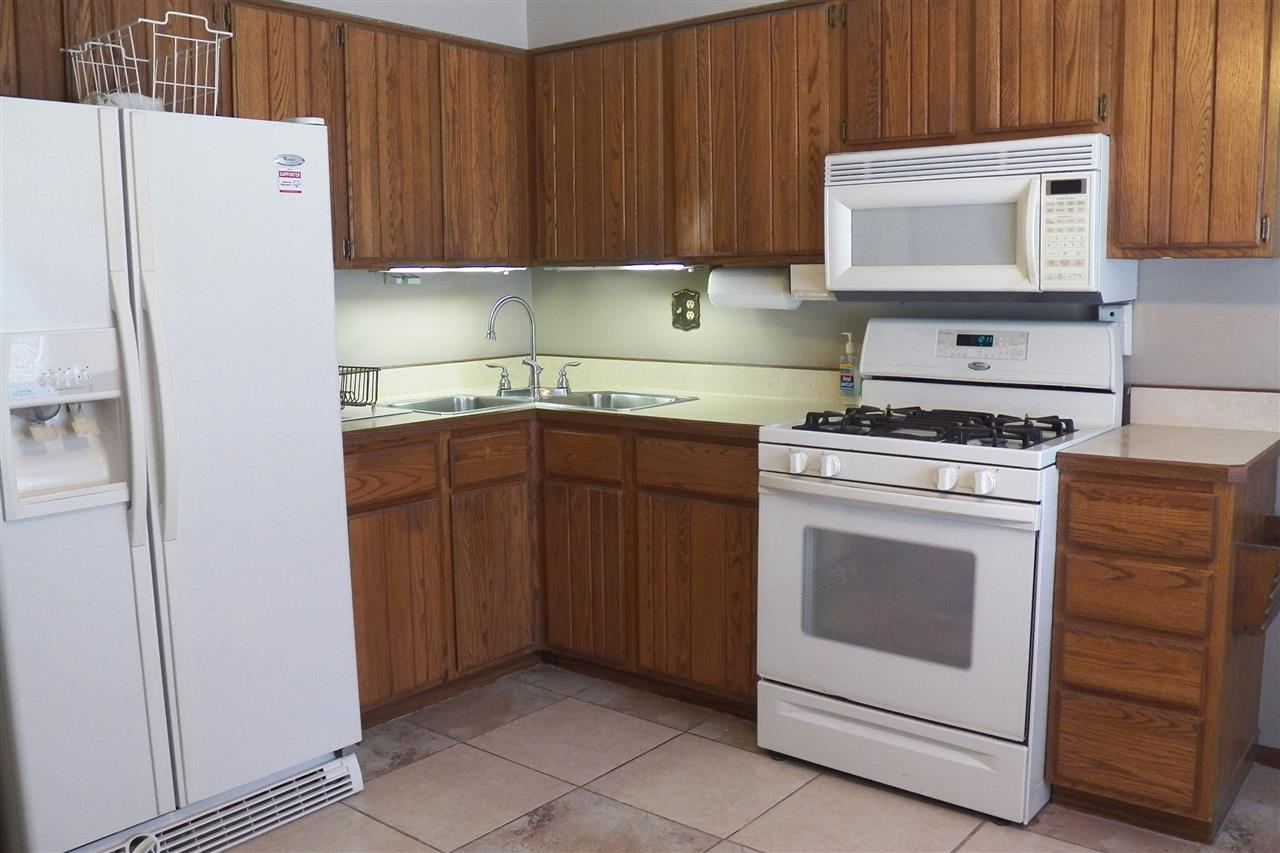 2325 Forest View Road Rockford, IL 61108 - Photo 7 of 17 a kitchen with cabinets appliances and a counter space