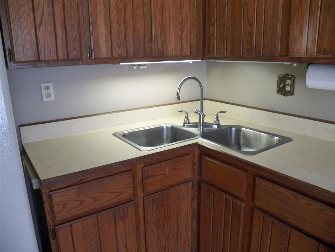2325 Forest View Road Rockford, IL 61108 - Photo 8 of 17 a kitchen with a sink cabinets and stainless steel appliances
