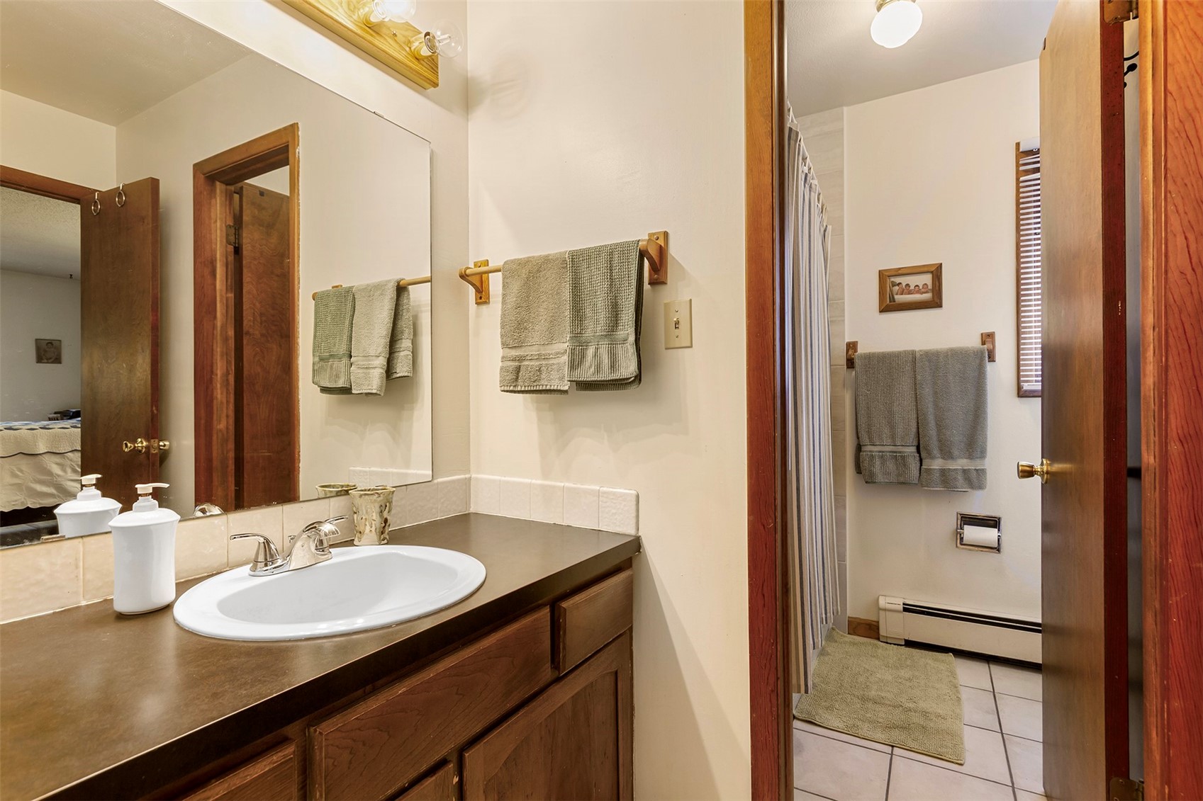 857 Deer Path Road Dillon, CO 80435 - Photo 17 of 29 a bathroom with a sink and mirror