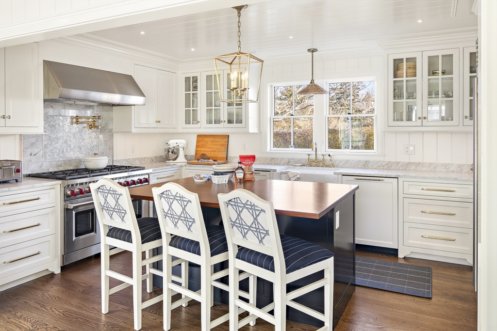 114 North Water Street Edgartown, MA 02539 - Photo 12 of 42 a kitchen with a stove a sink and a wooden floors