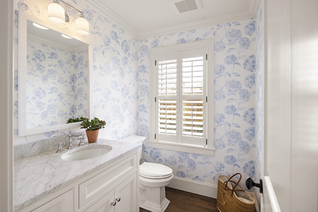 114 North Water Street Edgartown, MA 02539 - Photo 16 of 42 a bathroom with a granite countertop sink a toilet a mirror and shower