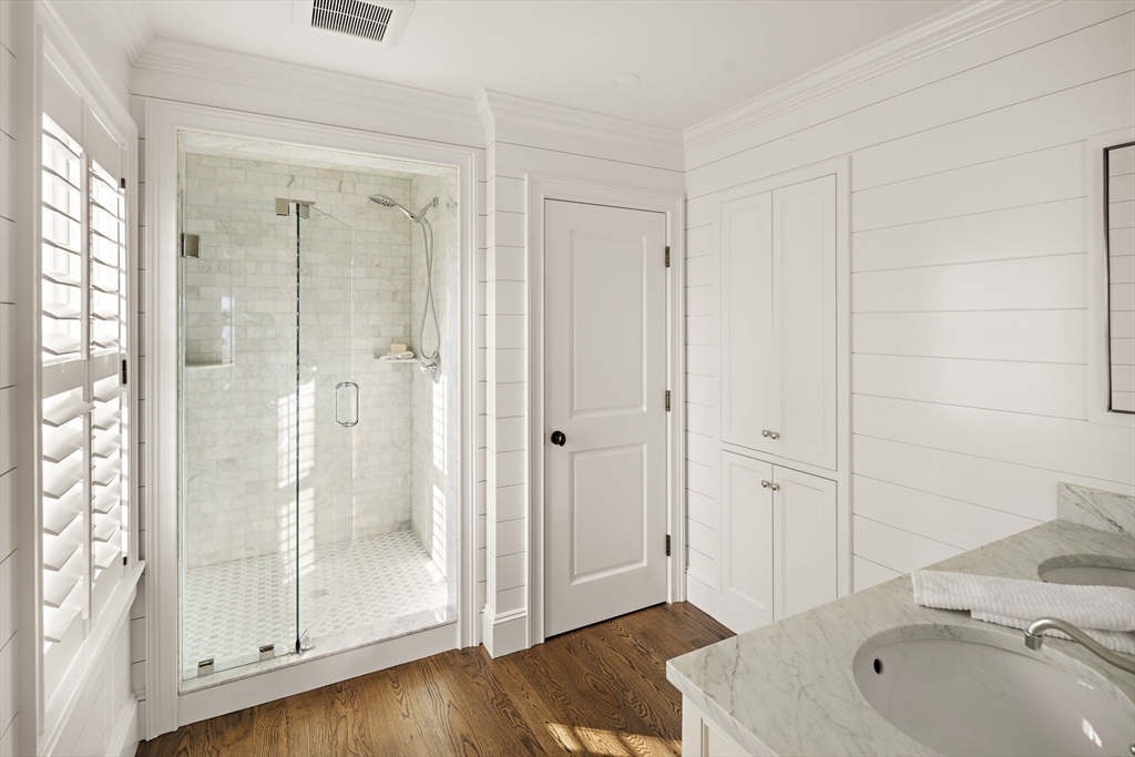 114 North Water Street Edgartown, MA 02539 - Photo 20 of 42 a bathroom with a tub shower sink and vanity