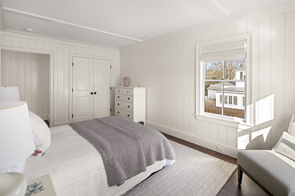 114 North Water Street Edgartown, MA 02539 - Photo 21 of 42 a bedroom with a bed and wooden floor