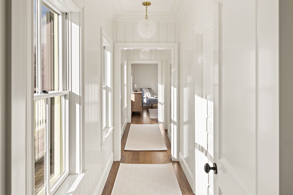 114 North Water Street Edgartown, MA 02539 - Photo 24 of 42 a view of a hallway with wooden floor and staircase
