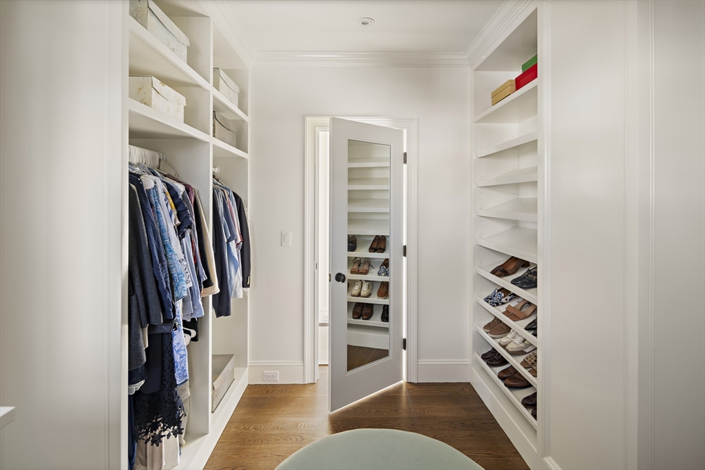 114 North Water Street Edgartown, MA 02539 - Photo 29 of 42 a view of walk in closet with clothes and shoes