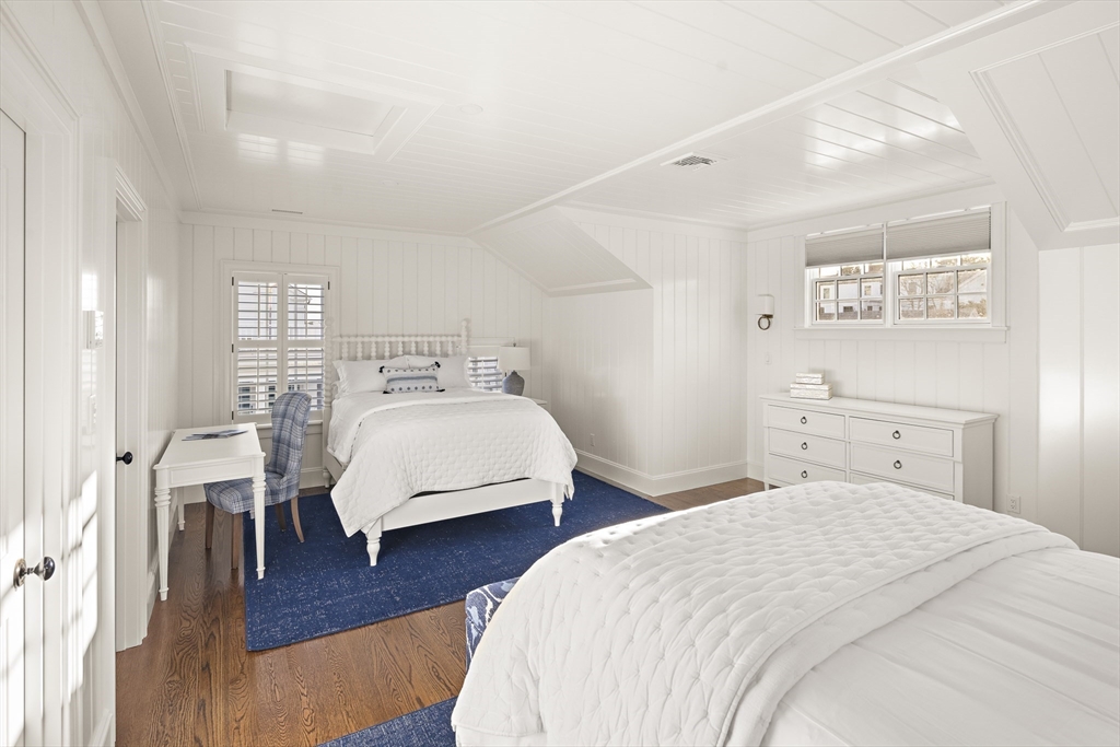 114 North Water Street Edgartown, MA 02539 - Photo 37 of 42 a bedroom with a bed and wooden floor
