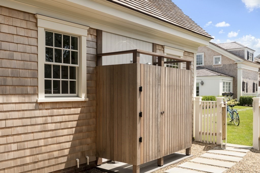 114 North Water Street Edgartown, MA 02539 - Photo 42 of 42 a front view of a house with a glass door