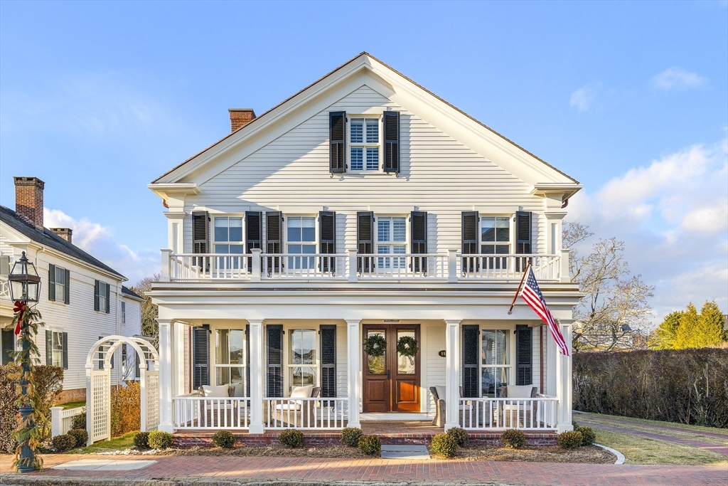 114 North Water Street Edgartown, MA 02539 - Photo 5 of 42 a front view of a house with a yard