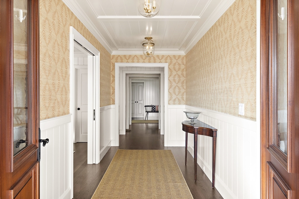 114 North Water Street Edgartown, MA 02539 - Photo 6 of 42 a view of a hallway view with wooden floor and staircase