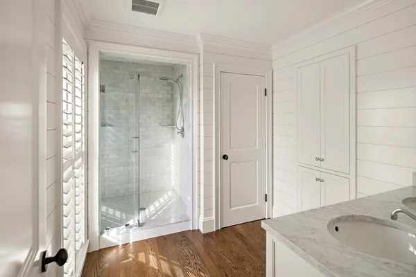 a bathroom with a sink and a shower