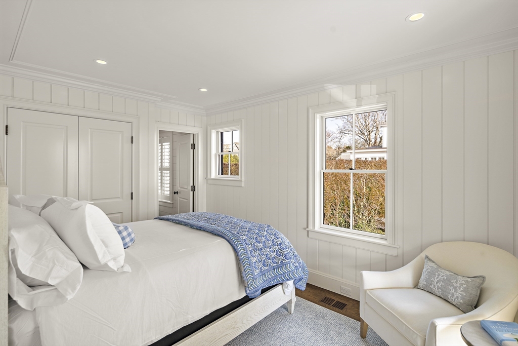 114 North Water Street Edgartown, MA 02539 - Photo 8 of 42 a bedroom with a bed and a couch