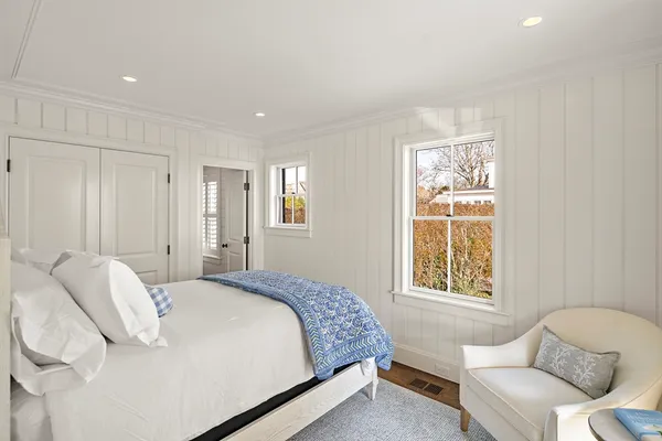 a bedroom with a bed and a couch