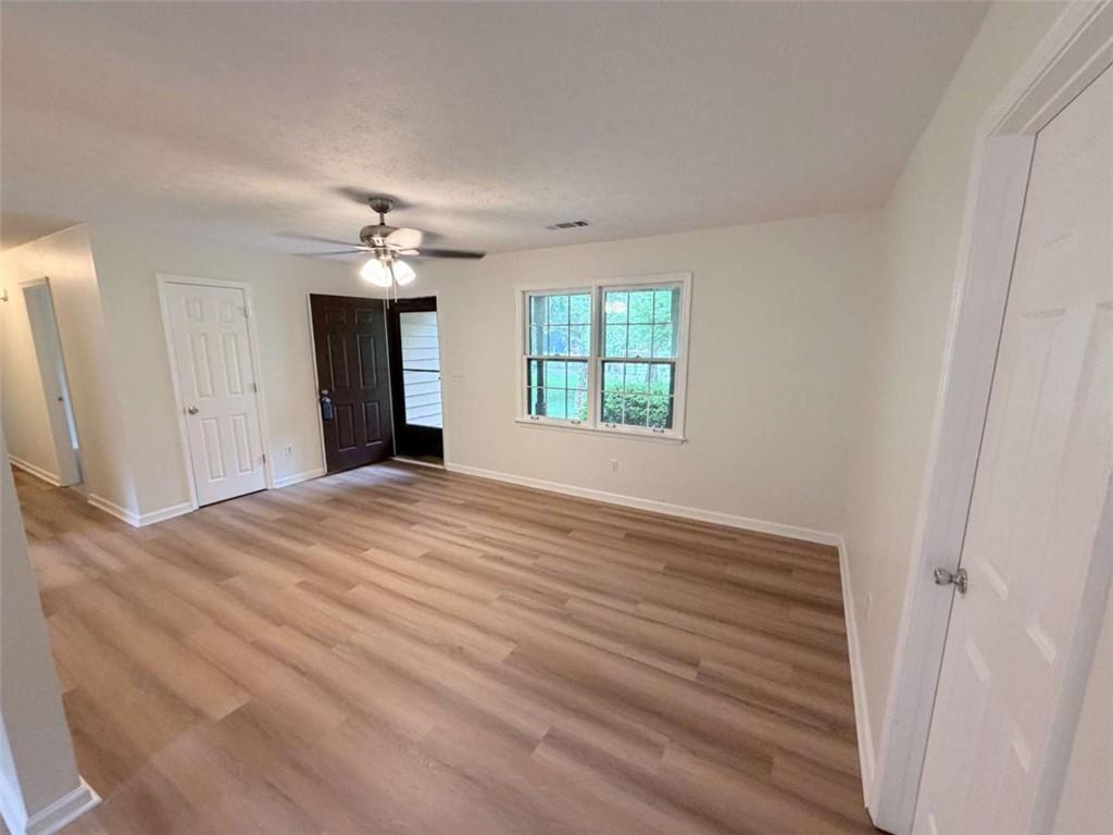 185 Roberts Road Covington, GA 30016 - Photo 9 of 25 a view of a livingroom with a chandelier