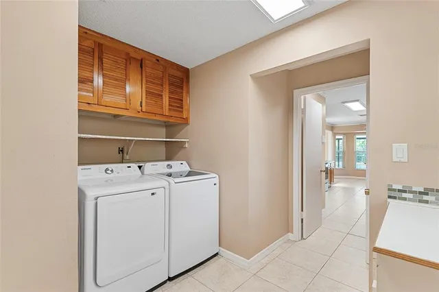 a view of storage and utility room with washer and dryer